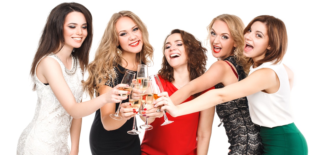 Portrait of joyful friends toasting at New Year party